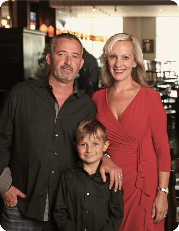 owners of old school smiling for portrait
